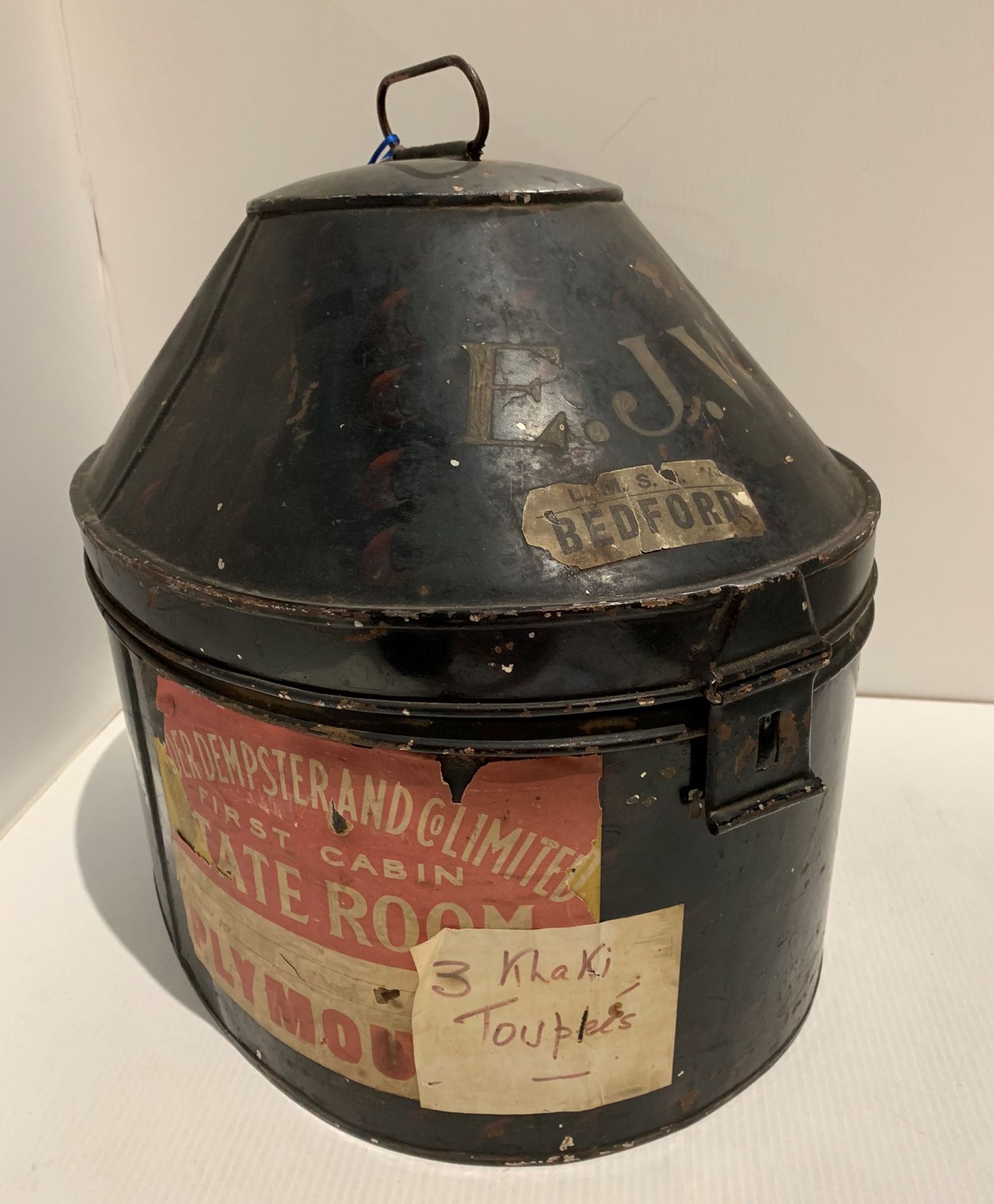 Tin hat box with shipping labels