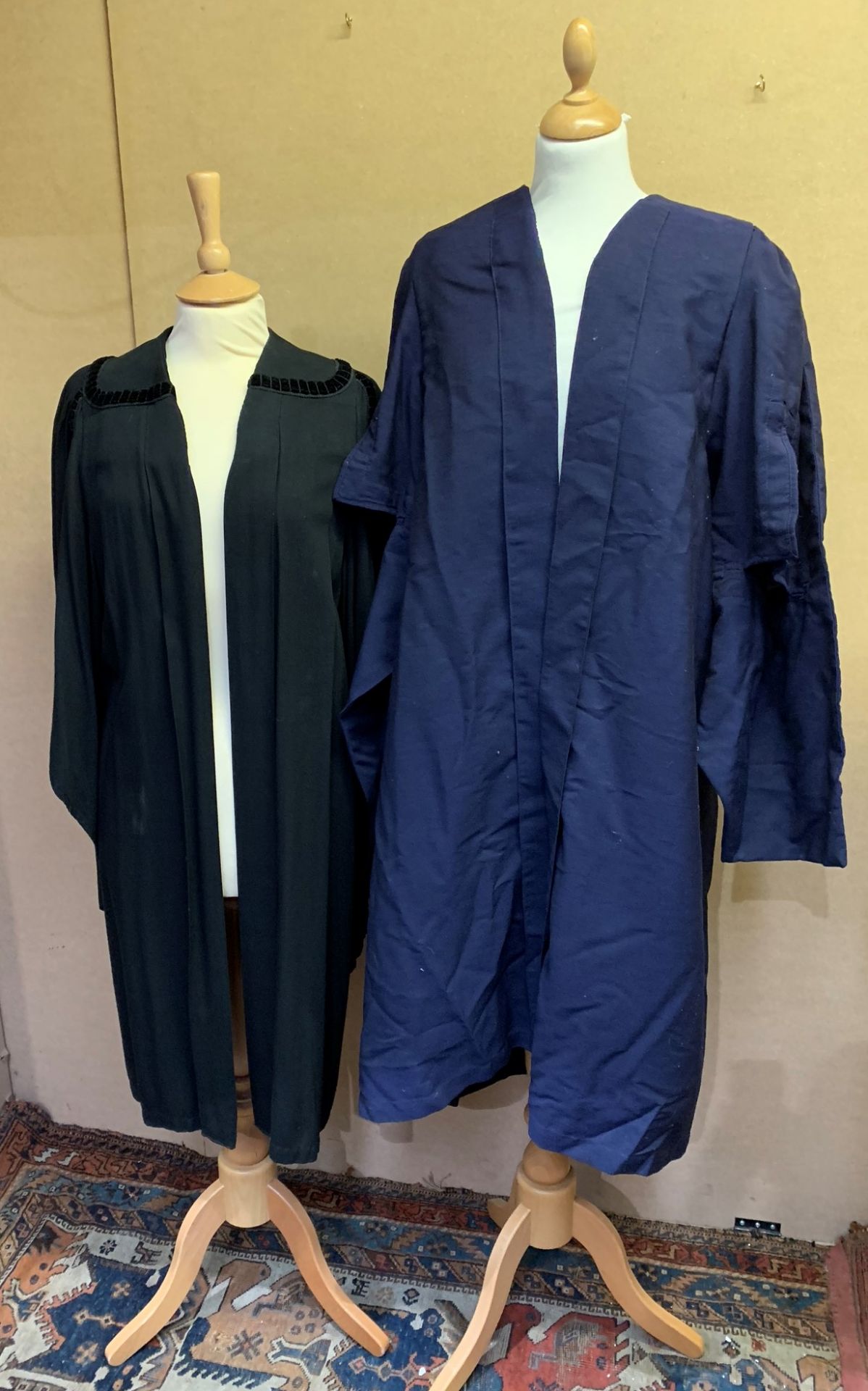 Two masters gowns, black and blue,