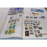 A Transworld stamp album containing World stamps