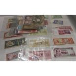 A collection of bank notes including earlier Cyprus,
