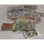 A collection of world banknotes including British Colonial,