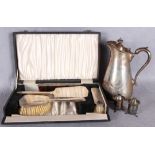 A three piece engine engraved silver-mounted dressing table set comprising two brushes and a hand