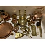 A quantity of brass and copper ware including kettle, bowls, trays, etc.