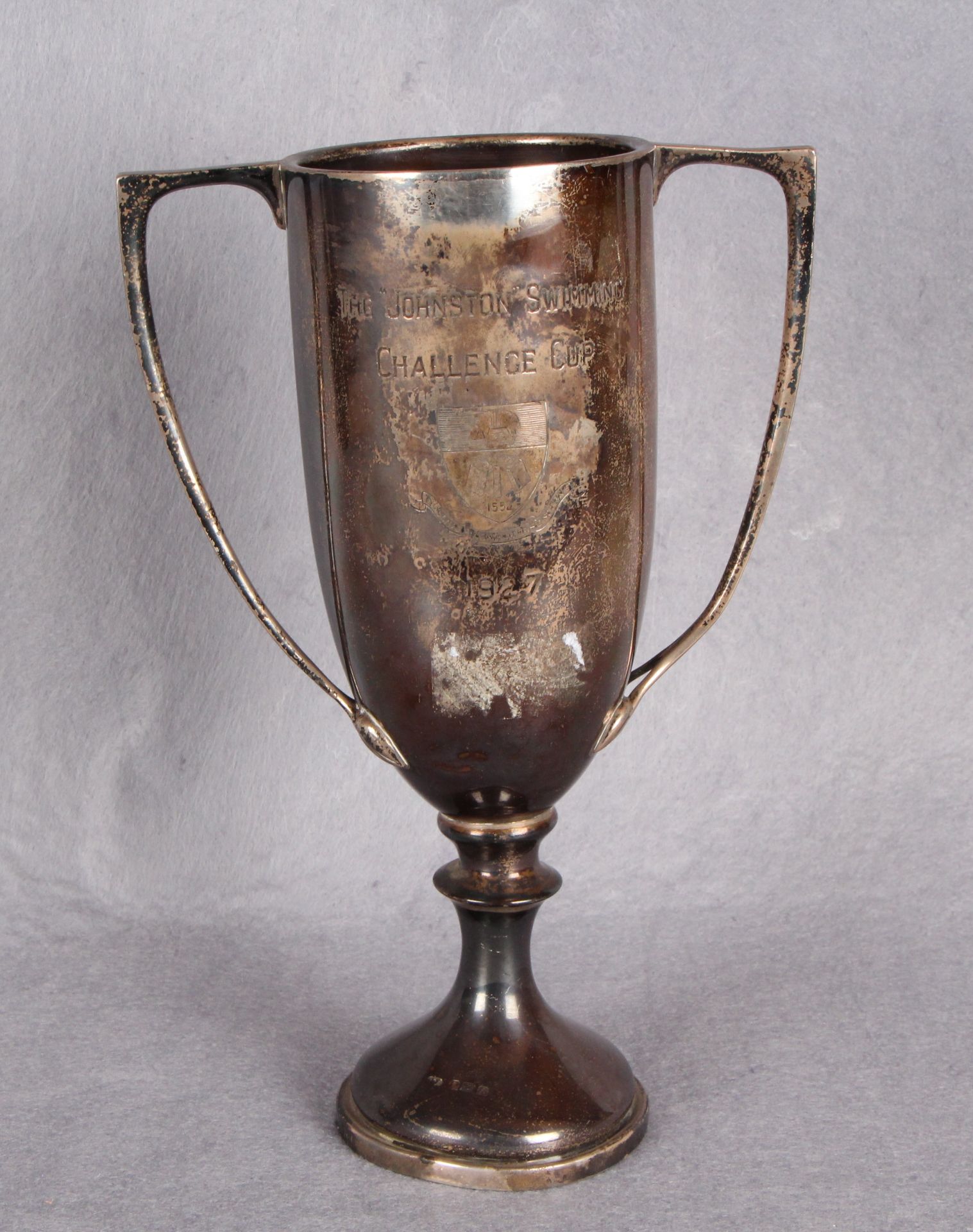 A two-handled circular section sports trophy "The Johnston Swimming Challenge Cup",