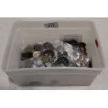 A tub containing UK and world coins