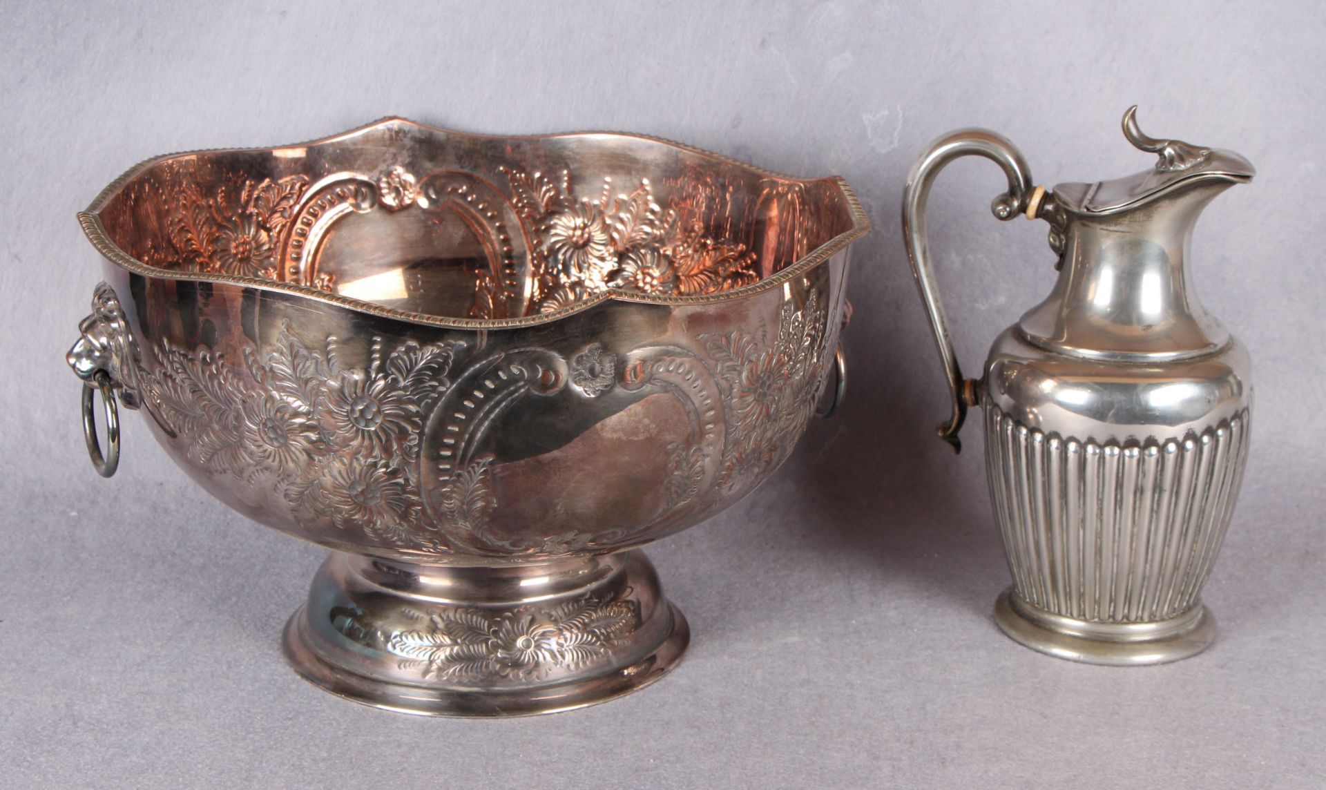 A Sheffield plate punch bowl with lion mask and ring handles,