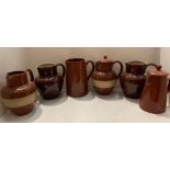 Six items of brown glazed pottery by Lovatts and Bourne potteries etc.