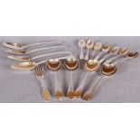 Assorted cutlery including four Georgian Old English pattern table spoons,