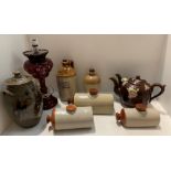 Two spout teapot, three stoneware bed warmers, two stoneware advertising jars, lamp etc.