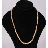 A gold bead necklace stamped 9ct (approximate weight 14.