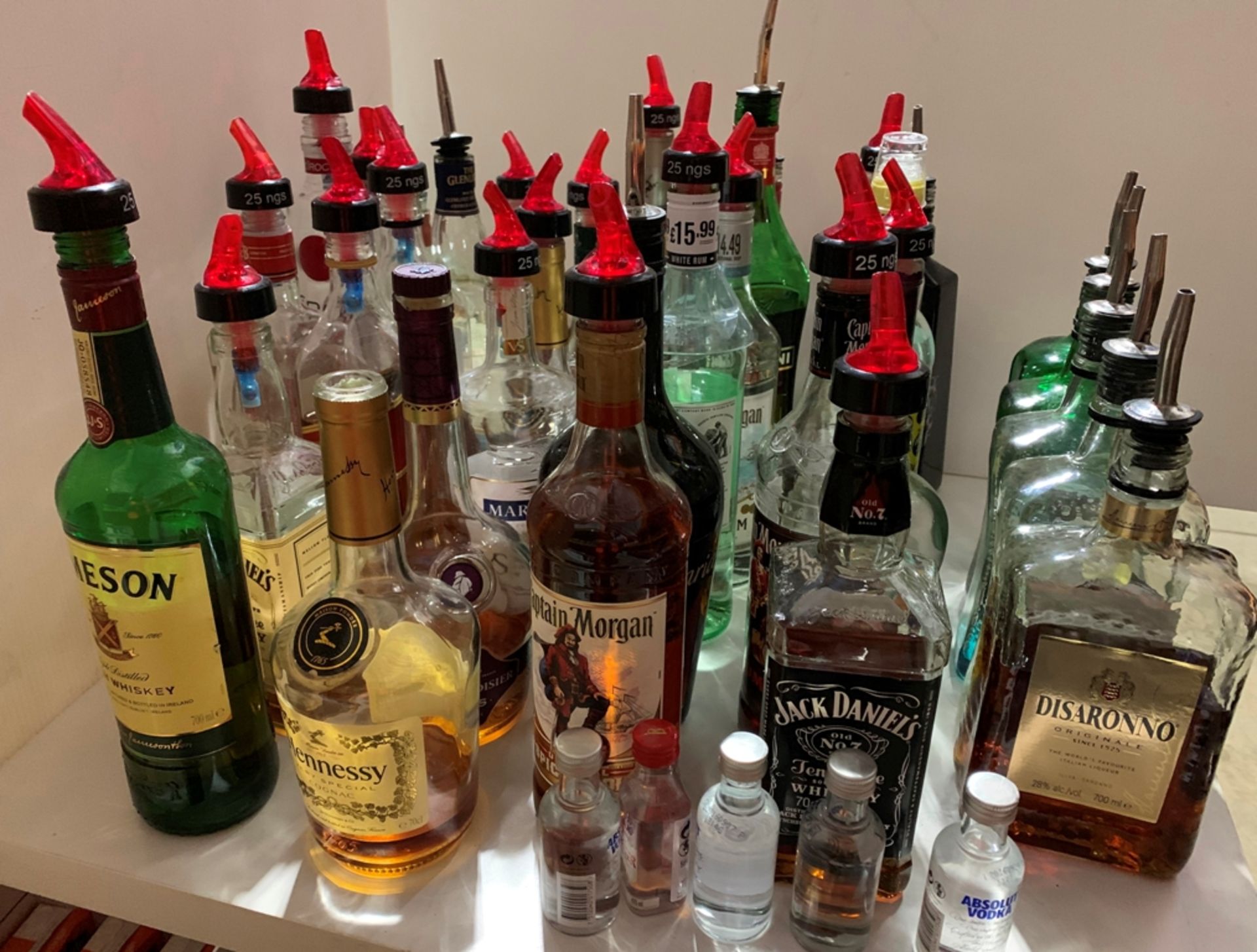 33 x part bottles of spirits - Disaronno, Captain Morgan, Jack Daniels, etc.