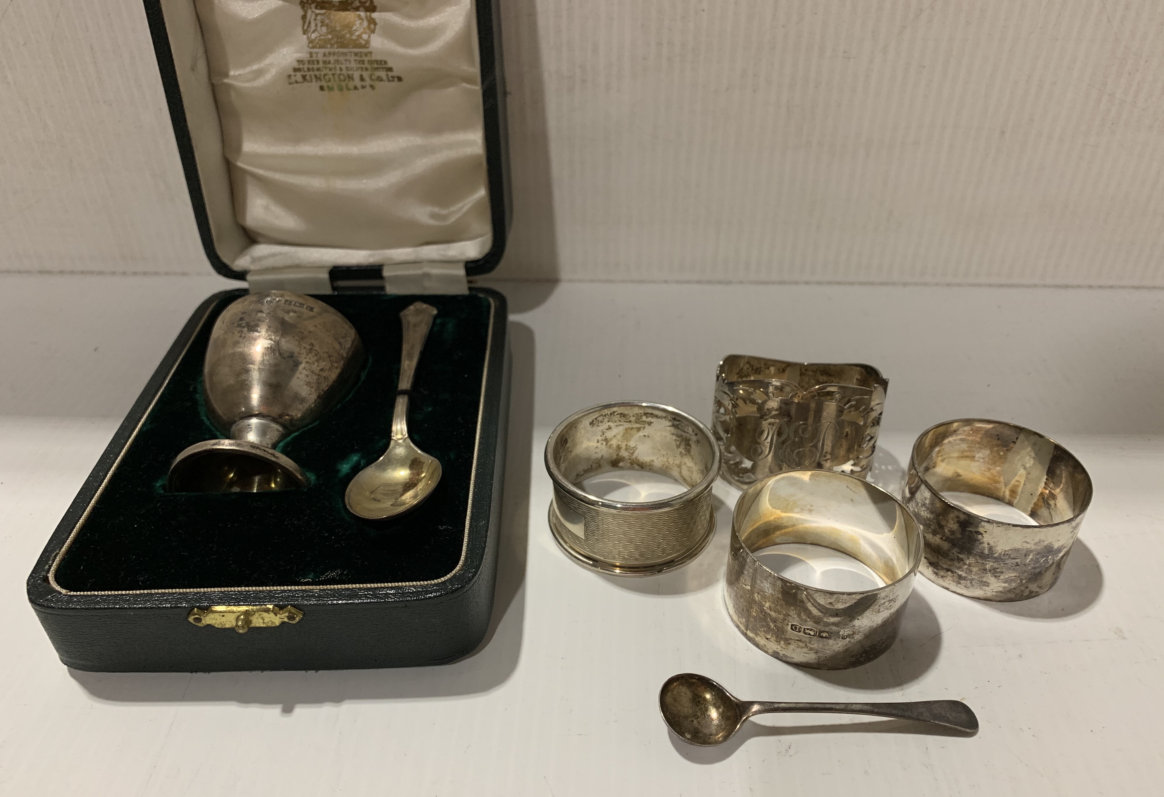 Silver egg cup and spoon, Birmingham 1959 together with four silver napkin rings,