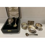 Silver egg cup and spoon, Birmingham 1959 together with four silver napkin rings,