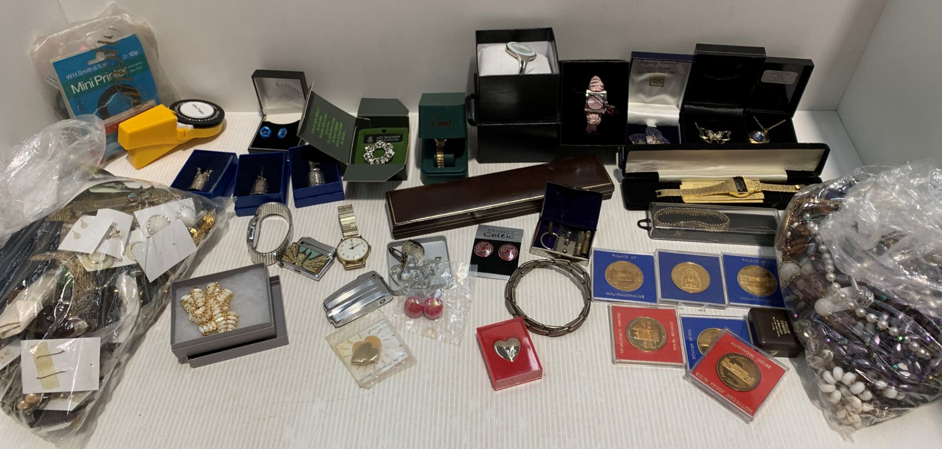 Large collection of costume jewellery, cans, lighters etc.