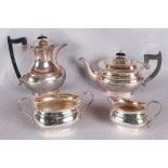 A four piece tea service, of rounded rectangular form, beaded borders,