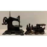 West German made hand operated sewing machine ref 122270 and a metal pull-a-long steam train