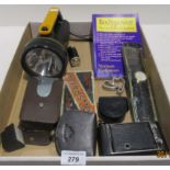 Contents to tray - torch, camera, watch,