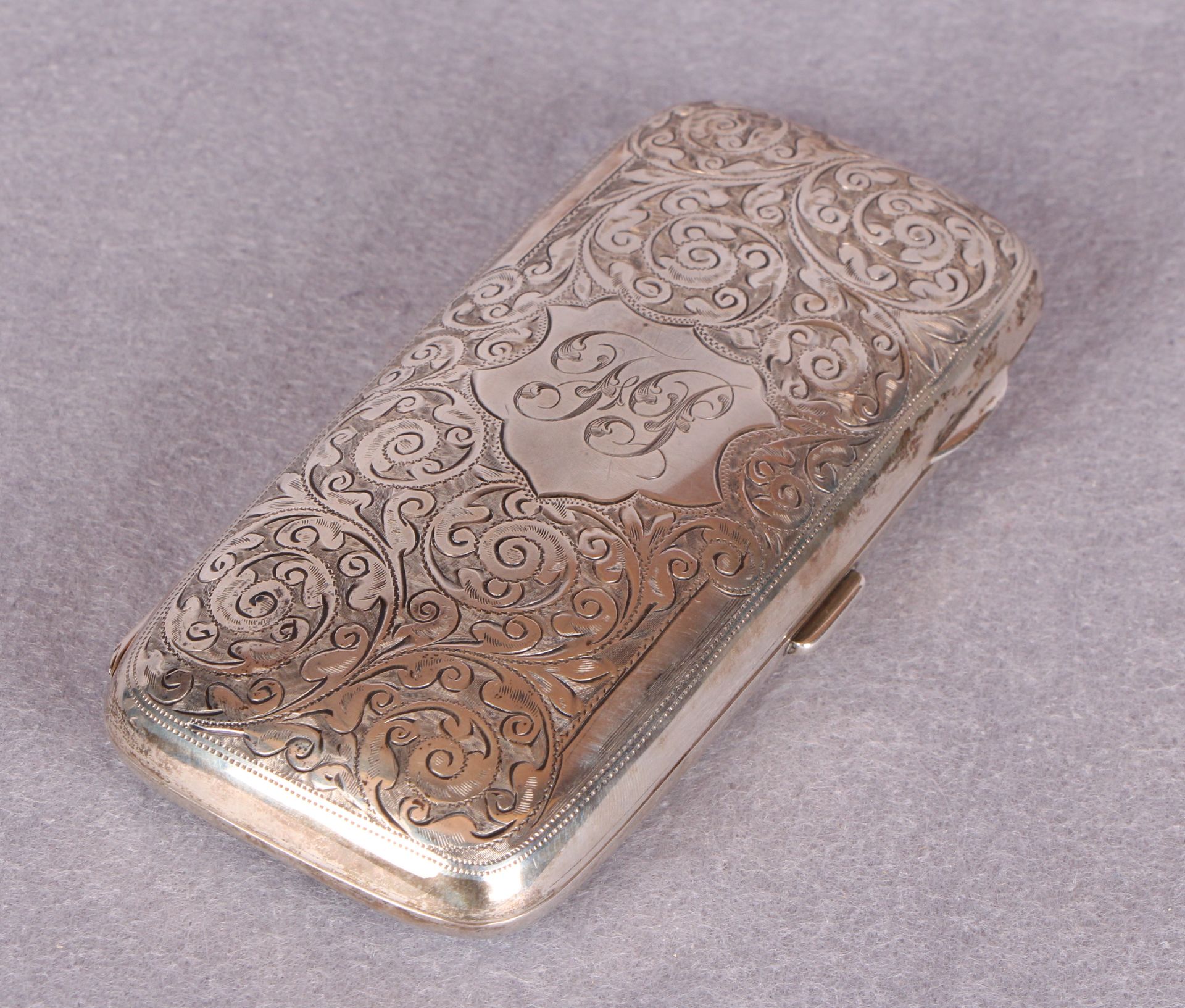 An Edwardian cigar case, overall engraved with foliage, the interior gilt, - Image 3 of 3