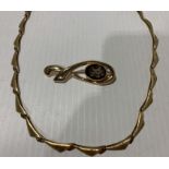 A 9ct gold necklace together with a 9ct gold brooch Further Information Total