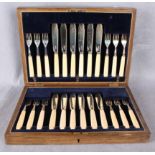 A set of twelve fish knives and forks, with ivory handles, Sheffield 1919,