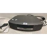 A Bose AWR Wave radio/CD music system complete with manual and remote control Further