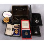 Two gilt metal Masonic jewels and three further medals of the Order of St John,