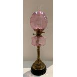 Victorian brass and pink glass oil lamp (with receipt for purchase in 2002 at £400) (please note