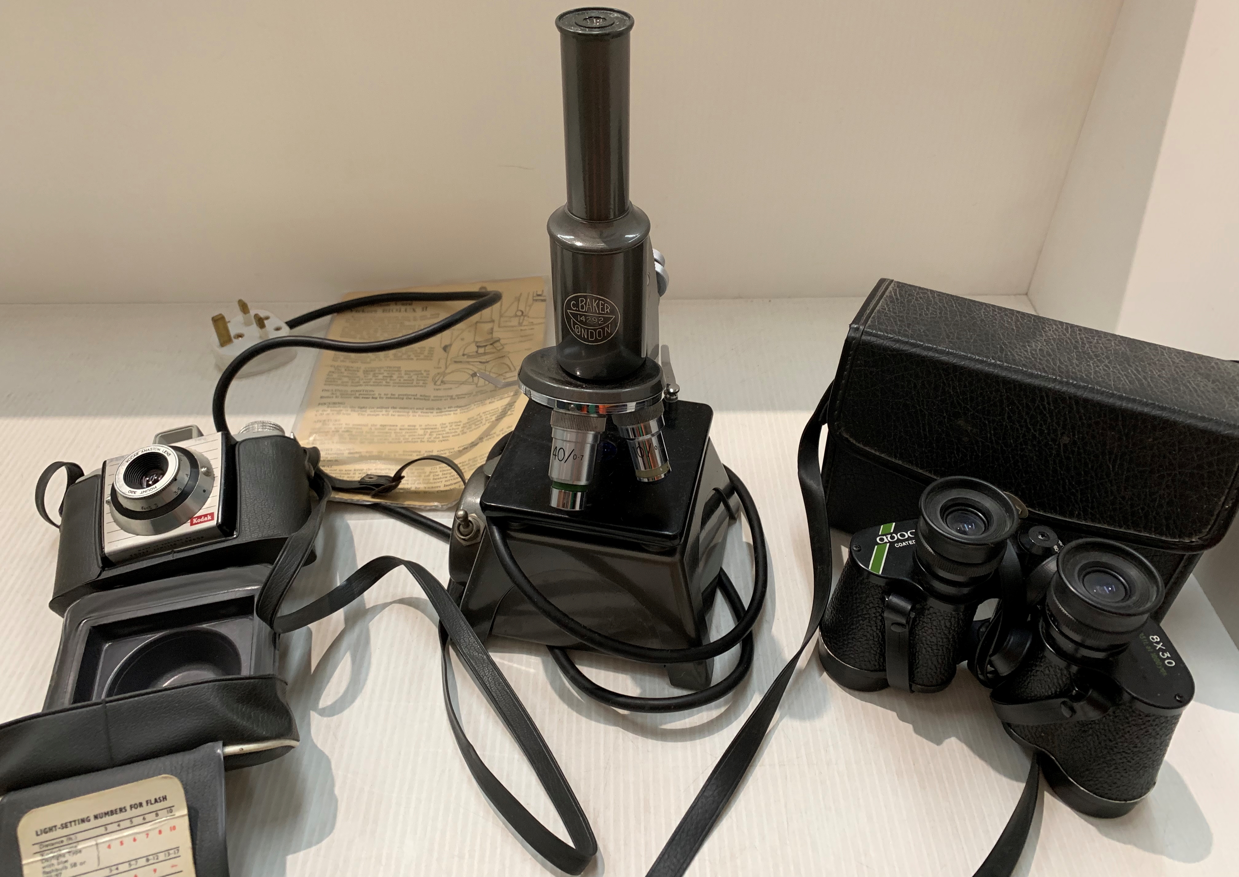 A Vickers Biolux 2 electric microscope initialled C Baker 14292, London, a pair,