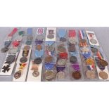 A collection of thirty five medals and medallions including Royal commemorative, Scholastic,