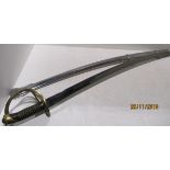 A cavalry sabre with brass handle and guard and metal sheath