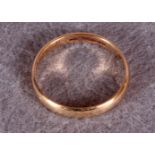 A gold wedding band, stamped 9.375 (approximate weight 1.