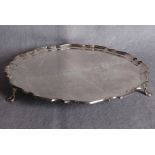 A shaped circular salver,moulded border, three hoof supports, London 1919 (approximate weight 31.