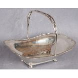 A shaped rectangular cake basket with swing handle, four ball feet,