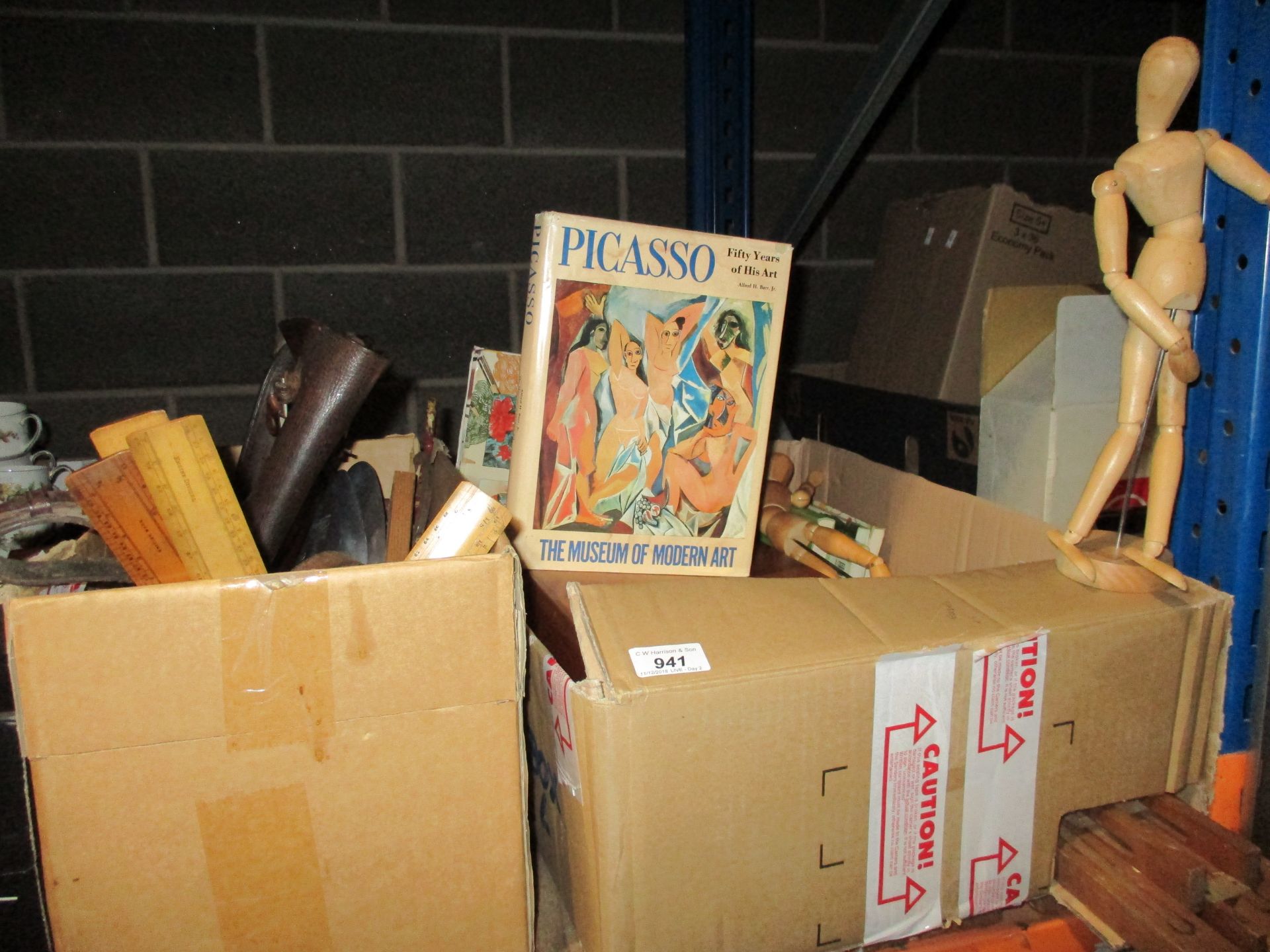 Contents to two boxes - easels, books of Picasso, brown leather satchel,