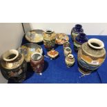 A collection of Japanese Satsuma style pottery, including vases,