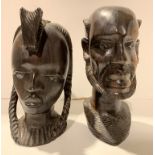 Two wooden carved ethnic heads,