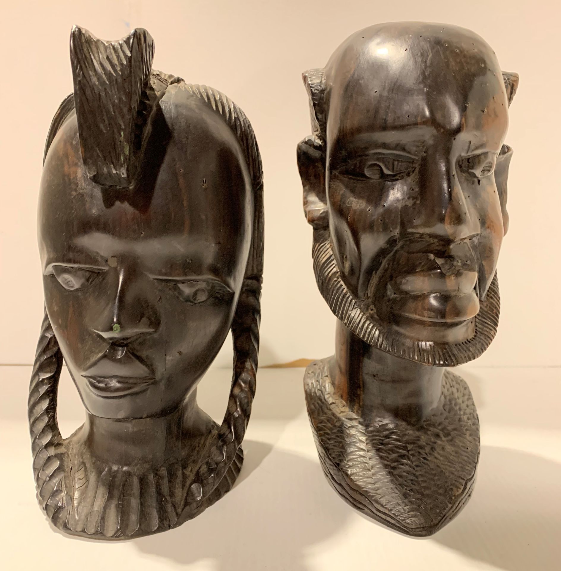 Two wooden carved ethnic heads,