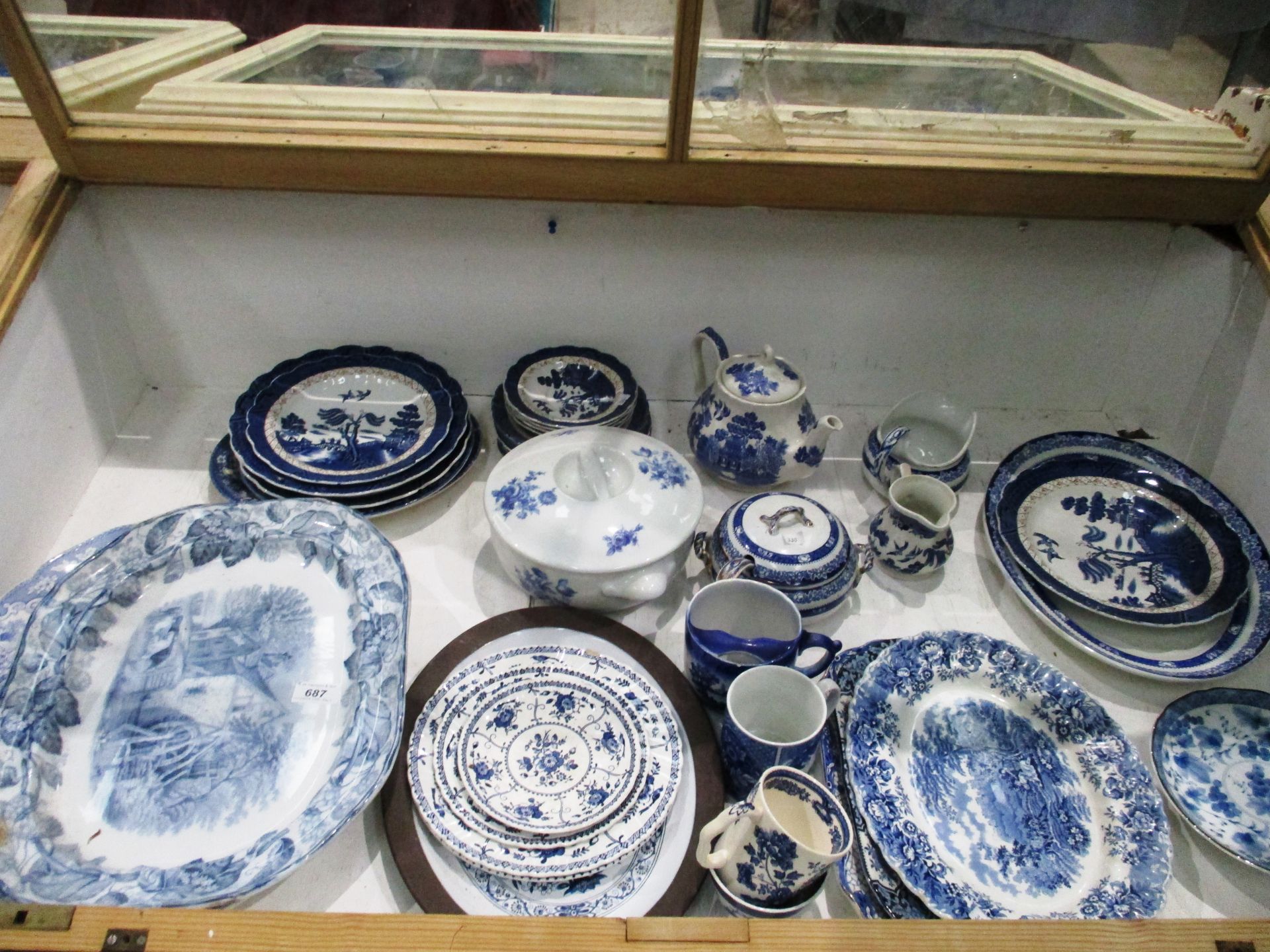 Contents to cabinet - a large quantity of assorted blue and white patterned ware - tureens, plates,