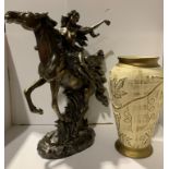 A composition gold coloured statue of a maiden on a horse,