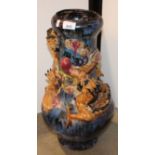 A Chinese stye pottery baluster vase, relief moulded with entwined dragons,