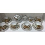 Japanese tea service comprising teapot, milk and sugar and six cups,