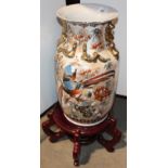 A Japanese style baluster china vase, painted and gilt with birds amongst flowering branches,