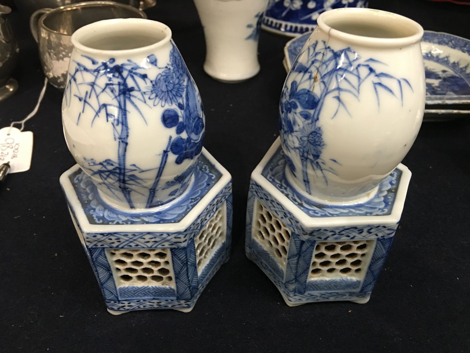 A pair of Japanese blue and white porcelain vases, each on a reticulated hexagonal section base, - Image 6 of 12