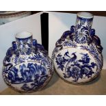 A large Chinese style blue and gilt decorated moon flask, twin dragon handles, 63 cm high,