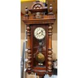 A late 19th century German regulator-style wall clock,