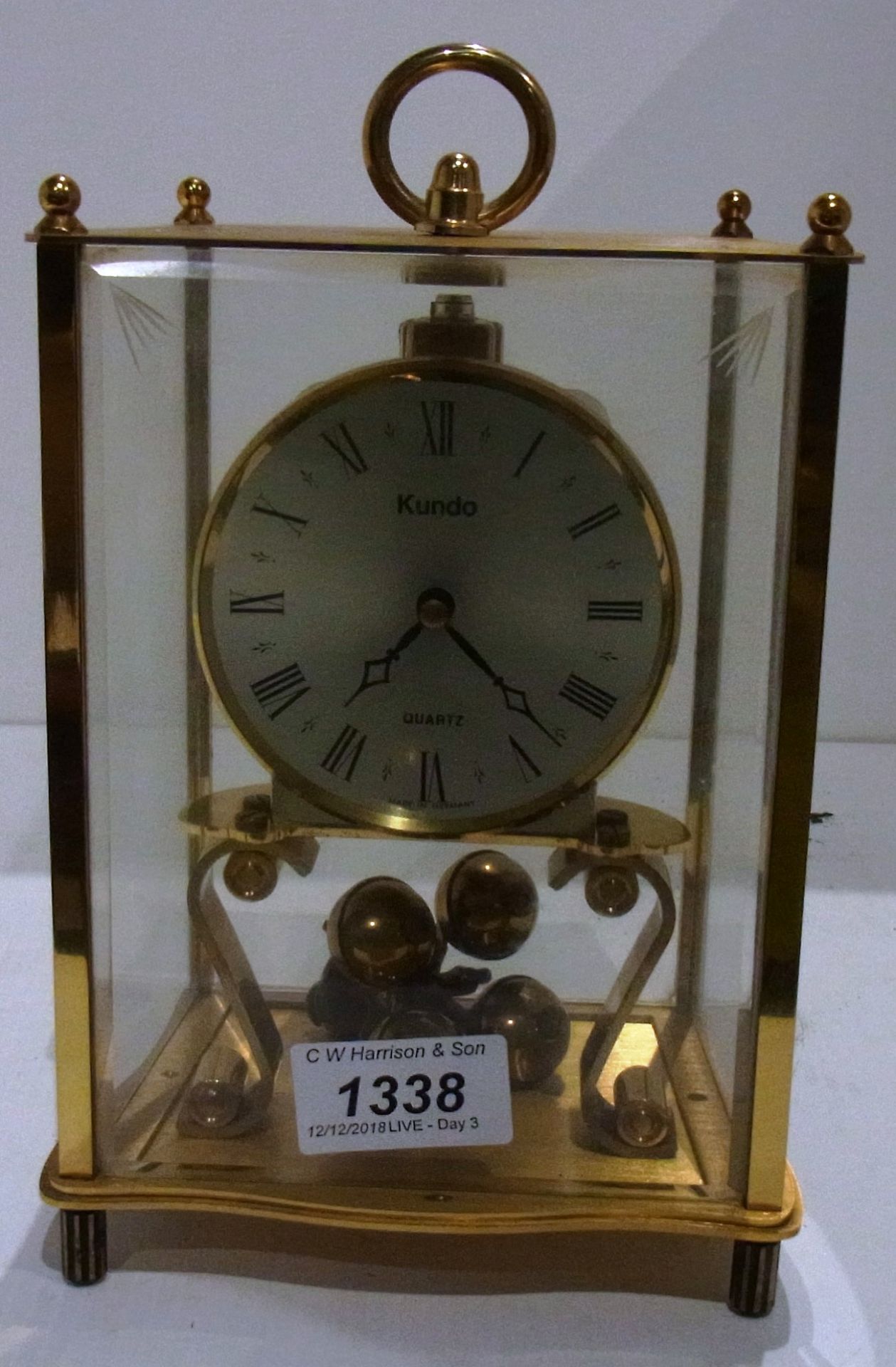 Kundo Quartz clock in glass case