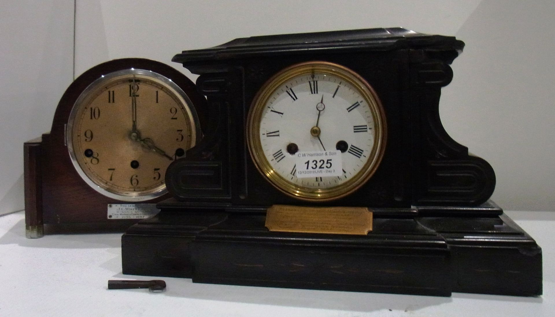 Black mantel clock with presentation plaque 1884 and oak framed mantel clock with plaque 1937 -