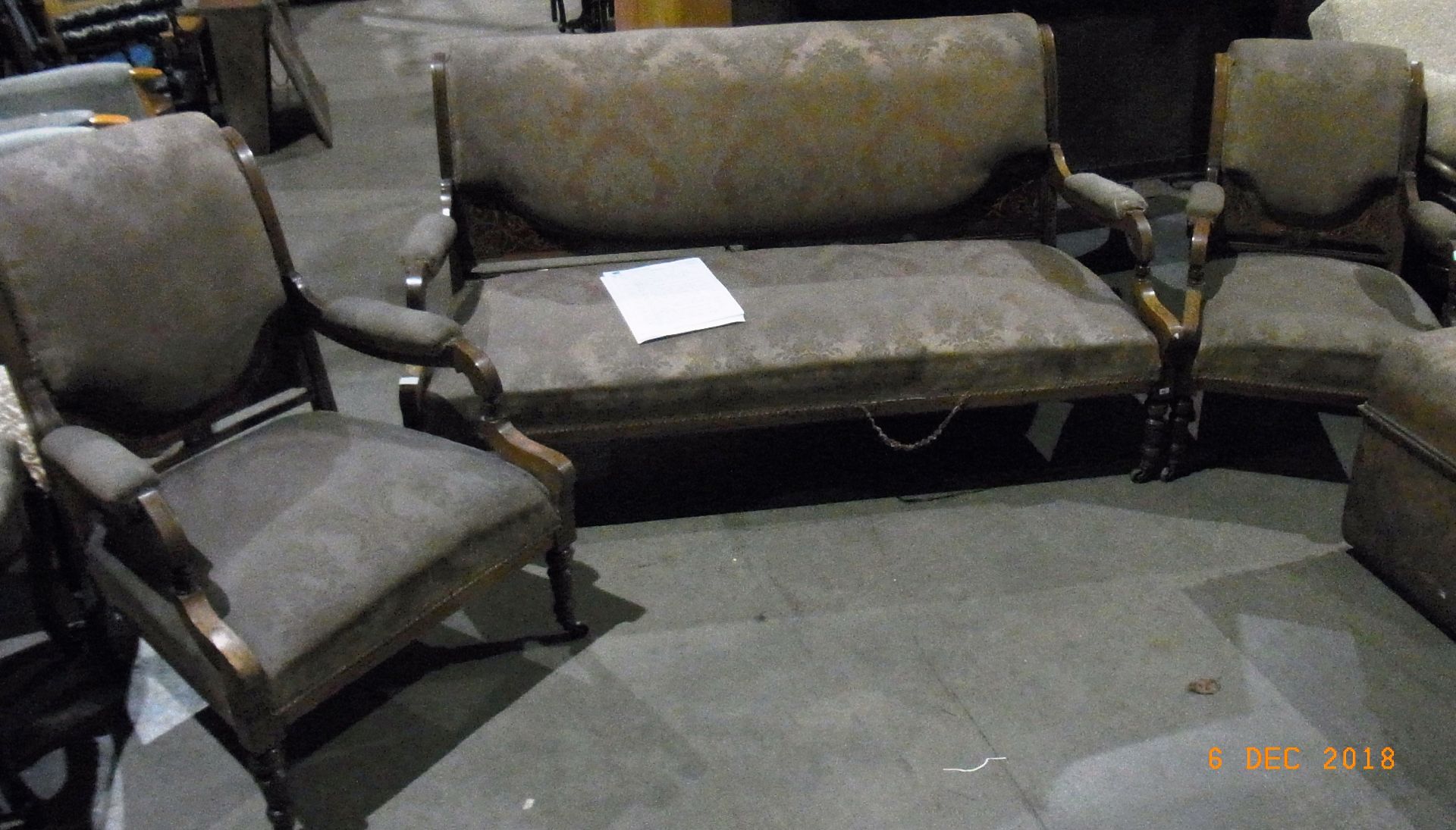 A late Victorian rosewood and inlaid sofa and two chairs,