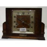 Rectangular oak cased mantel clock 8" with inscribed plaque 1945,