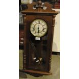 Wall mounted mahogany framed pendulum wall clock by Hermle 29"